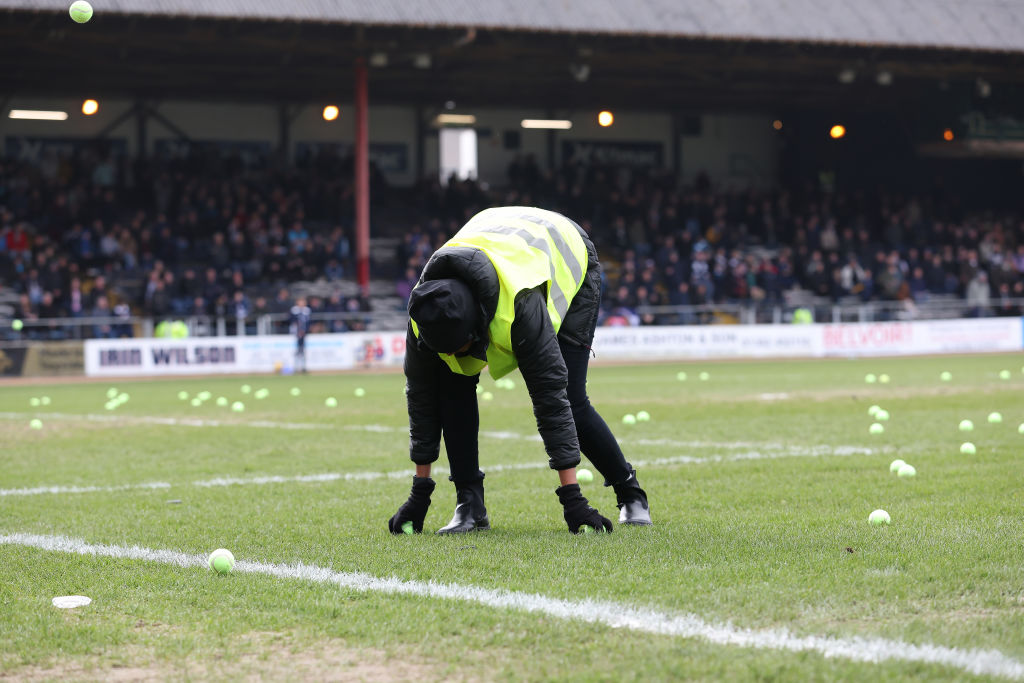 Rangers fans protested against the prospect of the Old Firm Derby taking place in Australia by throwing tennis balls on the pitch against Dundee