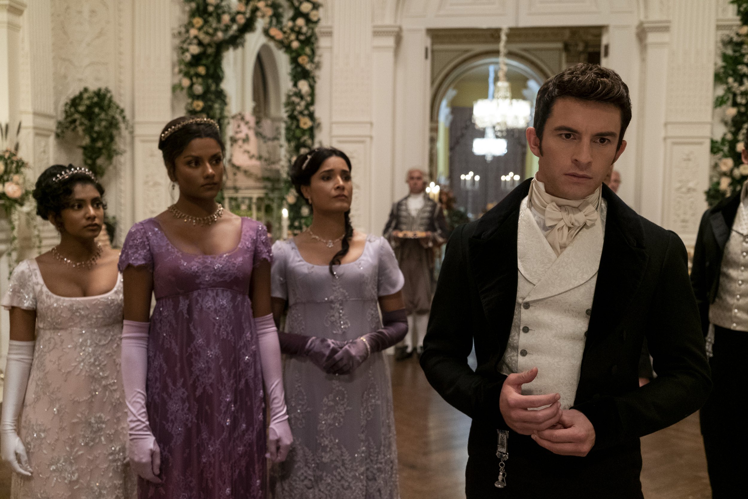 Charithra Chandran as Edwina Sharma, Simone Ashley as Kate Sharma, Shelley Conn as Mary Sharma, Jonathan Bailey as Anthony Bridgerton in Bridgerton